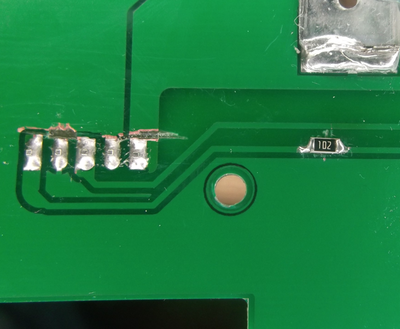 PPM Mod, the resistor on the right. Clean a bit of the track, cut in between and add the resistor (1K)